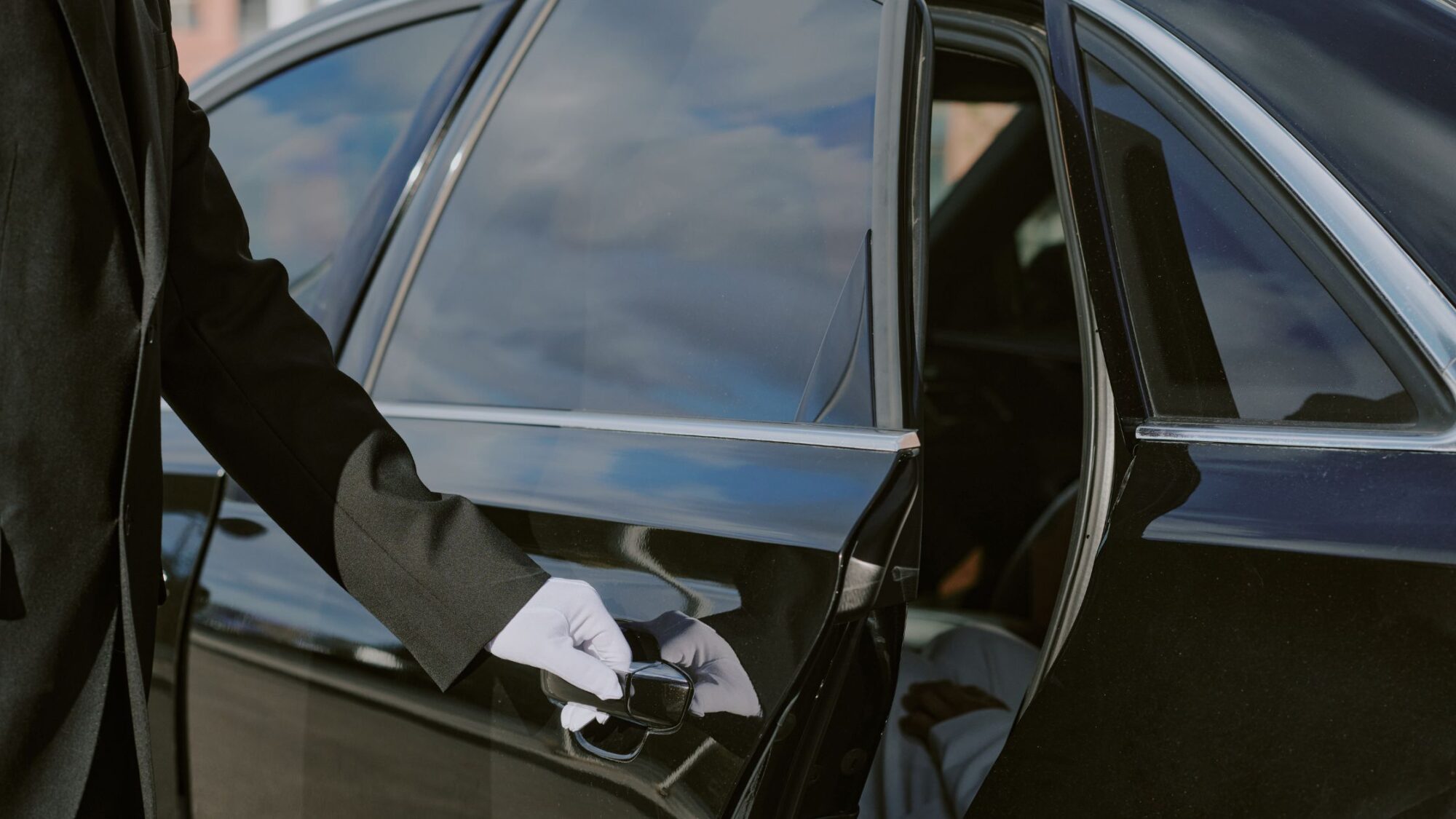 Chauffeur opening car door