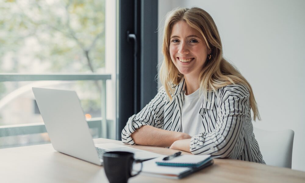 Professional woman working remotely enjoying happy office work