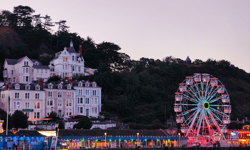 Charming Seaside Town at Twilight with Ferris Wheel